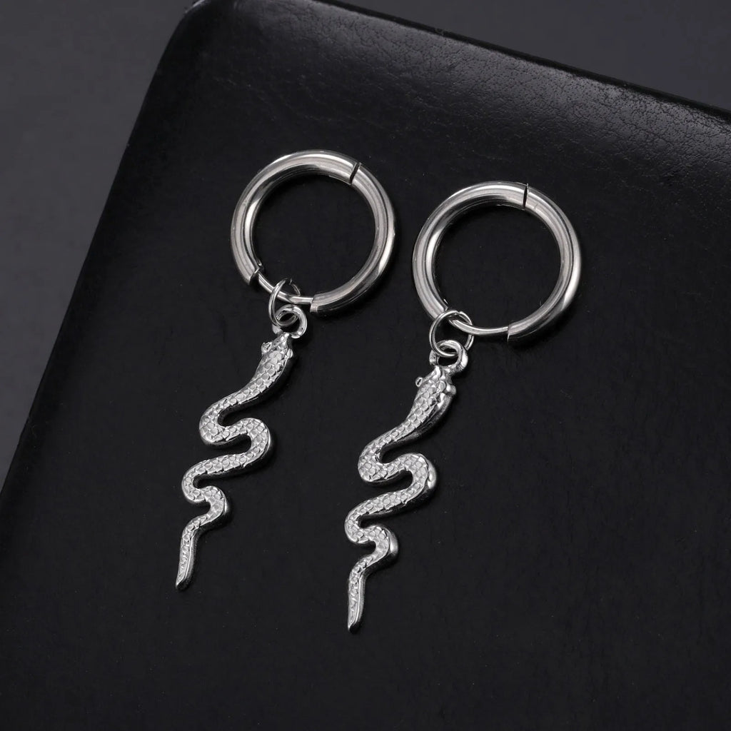A pair of vintage-style snake-shaped earrings made from gold plated stainless steel with an ear clip fastening.