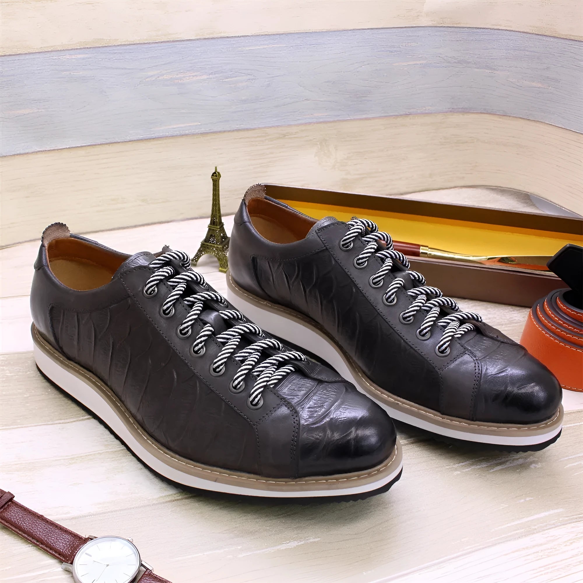 Men's low-top handmade shoes with an embossed pattern and front lace closure, shown in a choice of colours.