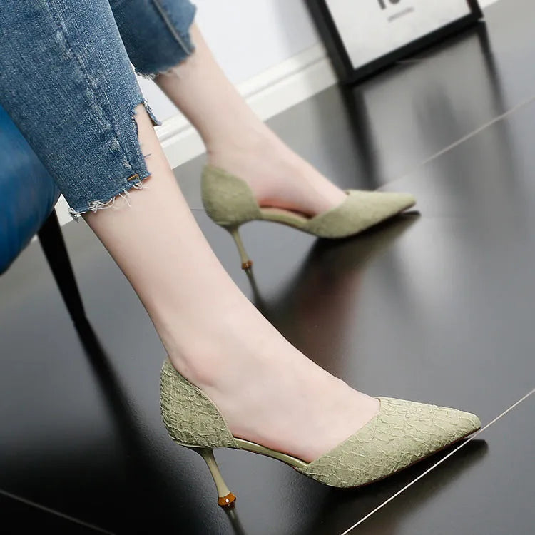 Women's black pointed-toe stiletto high heel pump with PU leather upper on a white background.