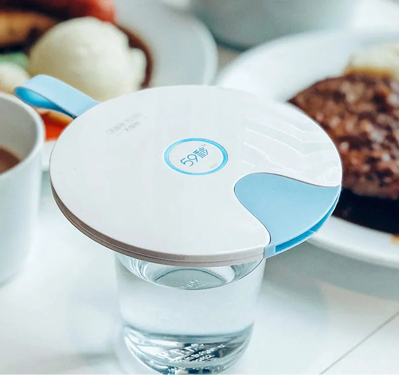 Portable blue UV baby bottle steriliser unit showing compact size and USB charging port.