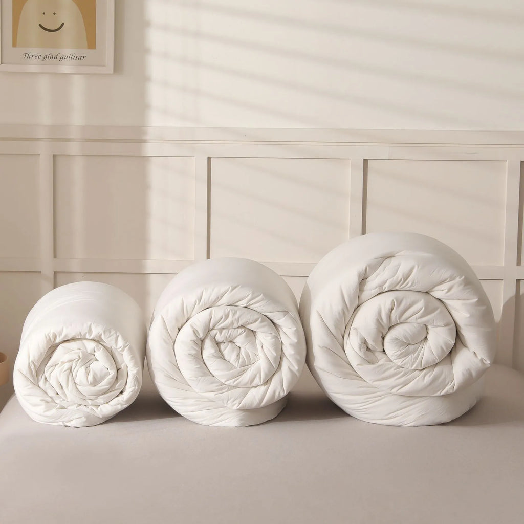 Soybean fibre filled pure cotton quilt in grey, shown on a bed in a 150x200cm size.