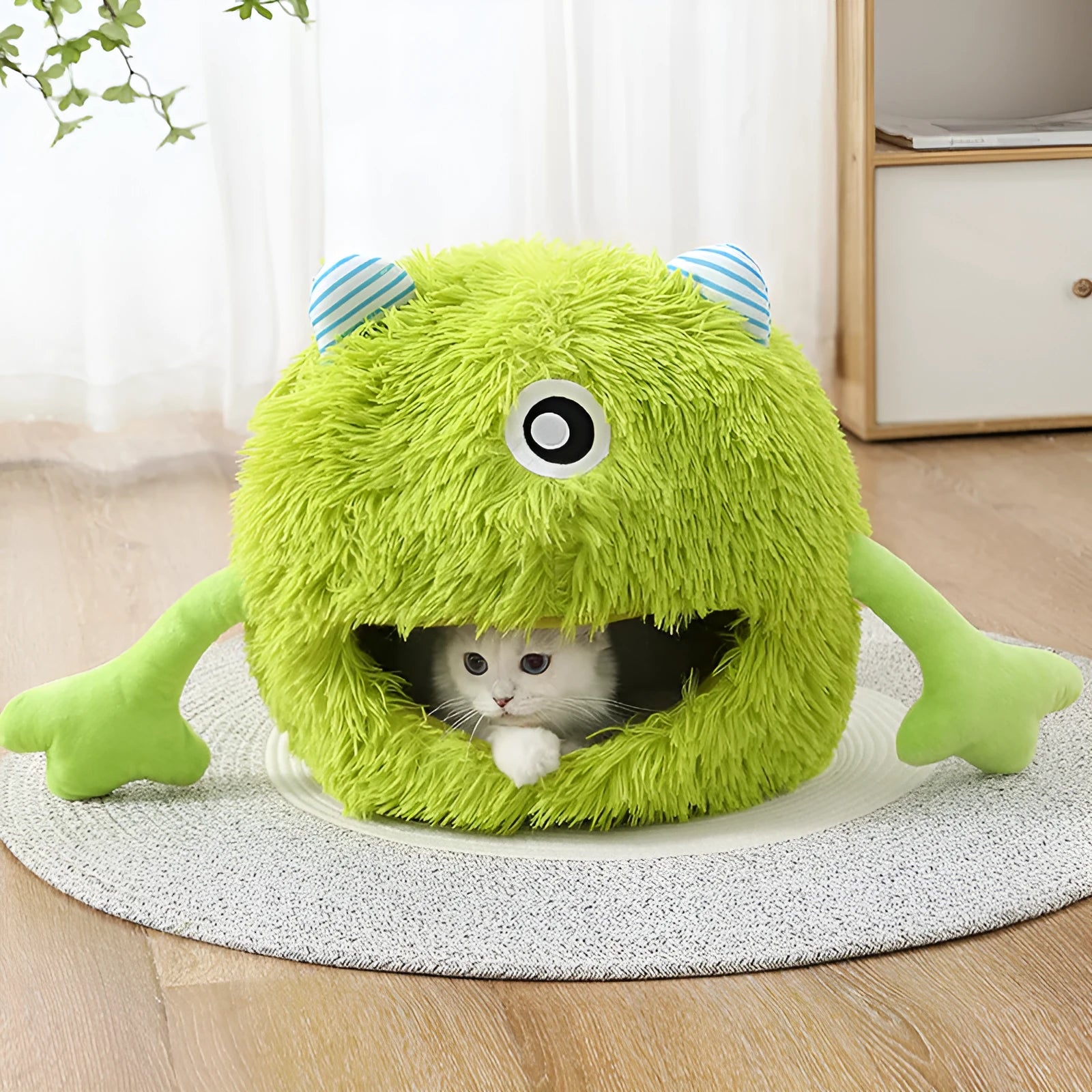 Fluffy round plush cat bed on a floor, shown in small, medium, and large sizes.