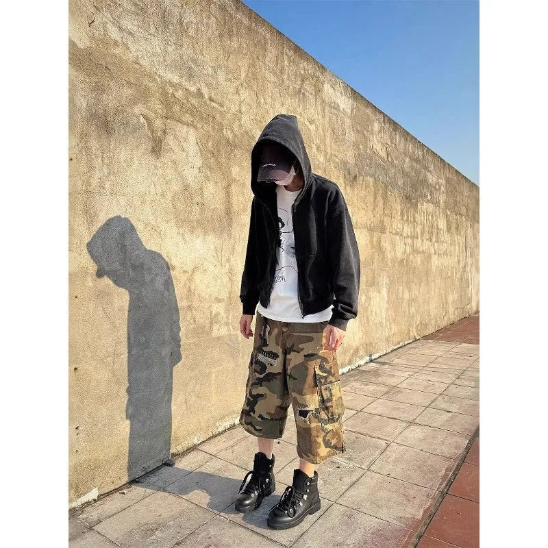 Men's camouflage cropped jeans with retro patches and ripped detailing on straight leg trousers