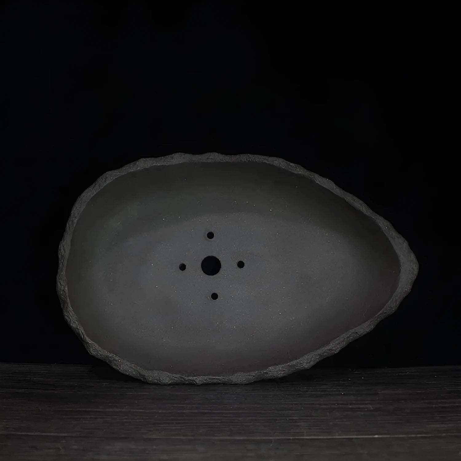 Handmade purple clay flower pot with traditional ceramic finish and drainage hole