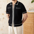 Slim fit black knitting polo shirt with short sleeves and lapel collar on a male model