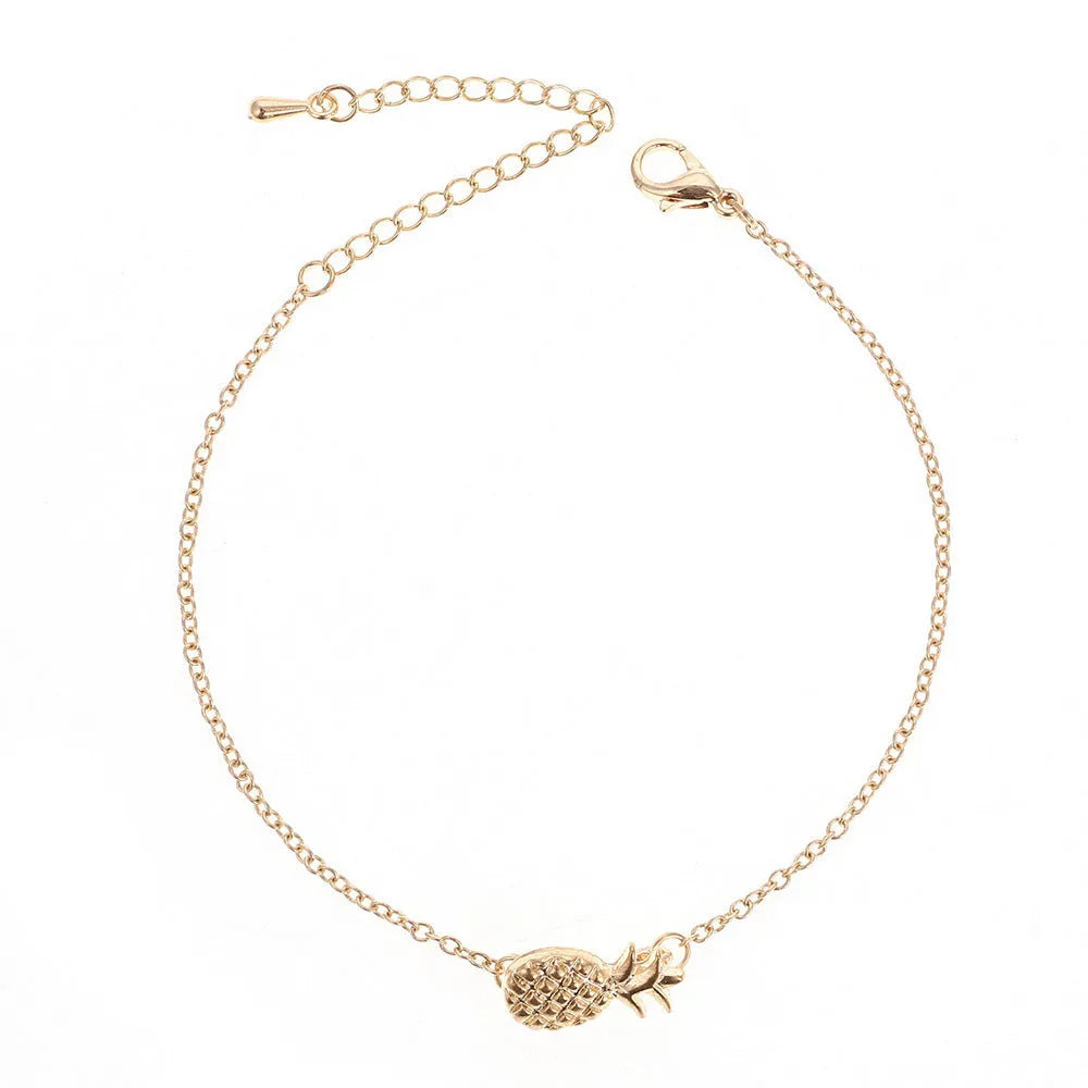 Women's alloy pineapple bracelet from XINGX series in gold or silver colour on wrist.