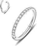 Stainless steel seamless nose ring with diamond accent in gold finish showing circular barbell design