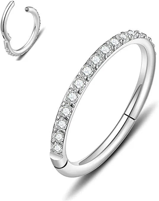 Stainless steel seamless nose ring with diamond accent in gold finish showing circular barbell design