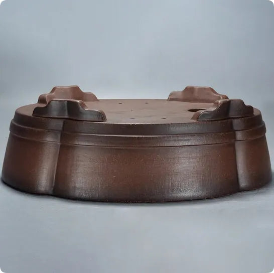A simple classical-style purple clay bonsai pot for tabletop or floor plant display.
