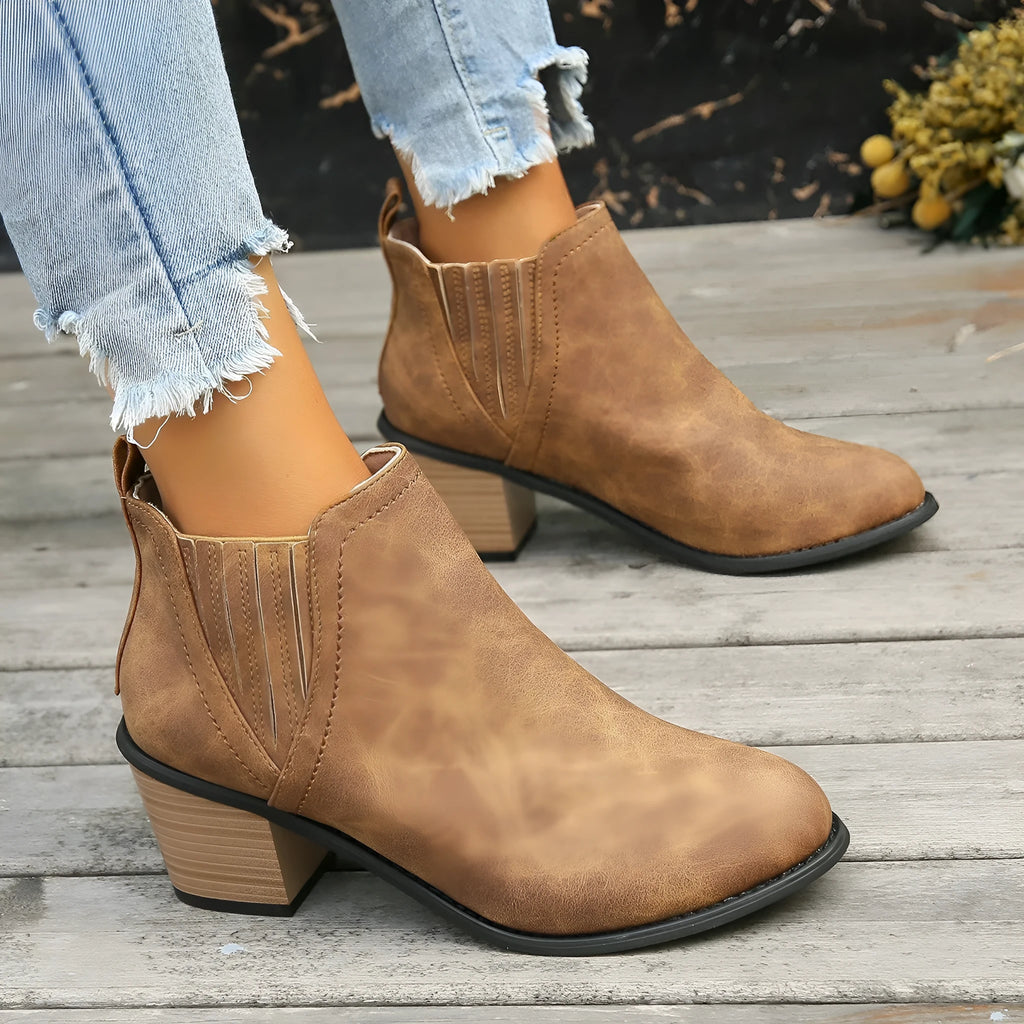 Women's black pointed toe ankle boots with thick square low heel slip-on design
