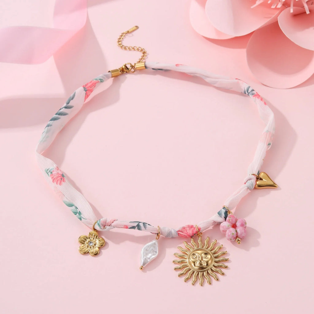 Gold plated stainless steel necklace with a choice of a geometric sun or heart pendant on a 41-50cm chain.