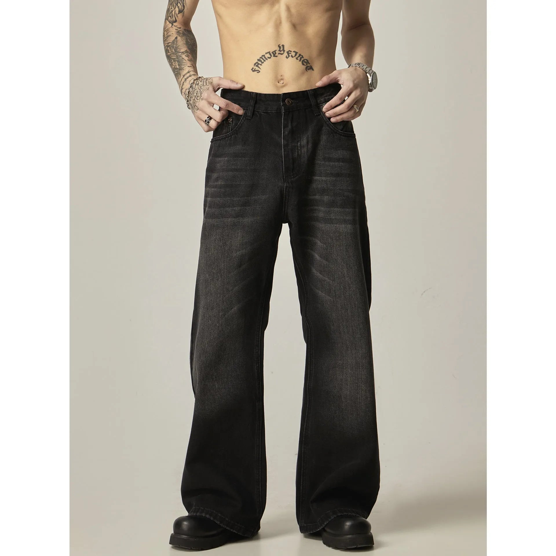 Black loose straight-leg retro jeans with zipper fly on mannequin
