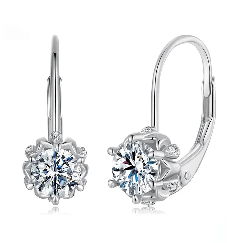 Close-up of a sterling silver flower bud ear clip with a white gold plated finish and a central 0.5 carat moissanite stone.