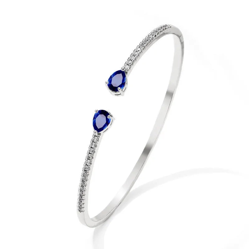Personalised multi-zircon copper bracelet showing white and blue colour options with simple design