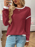 Women's loose round neck long sleeve polyester pullover top in multiple colours.