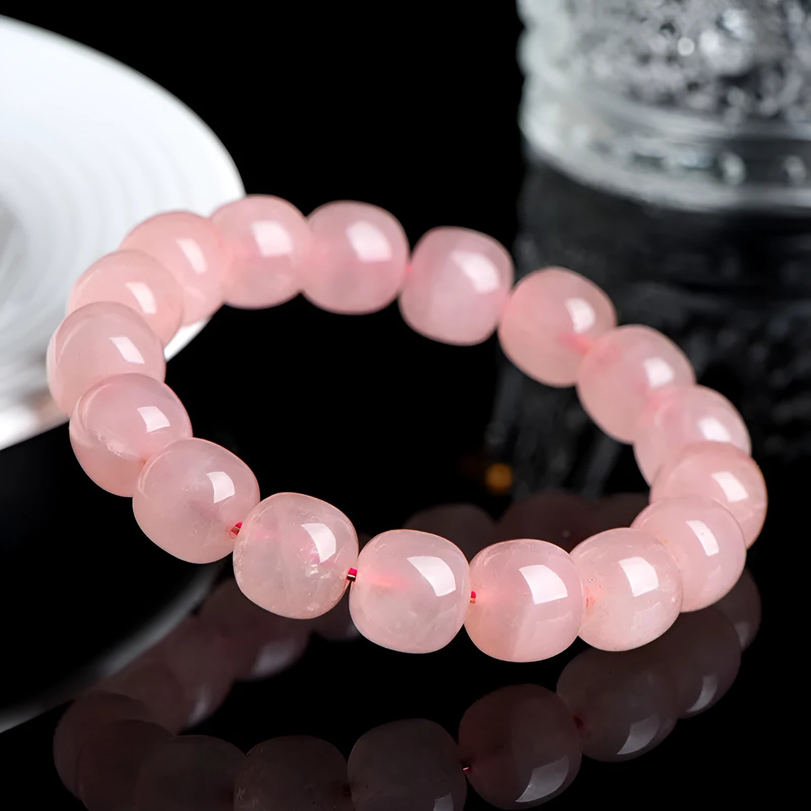 Pink crystal barrel bead bracelet with geometry design on wrist