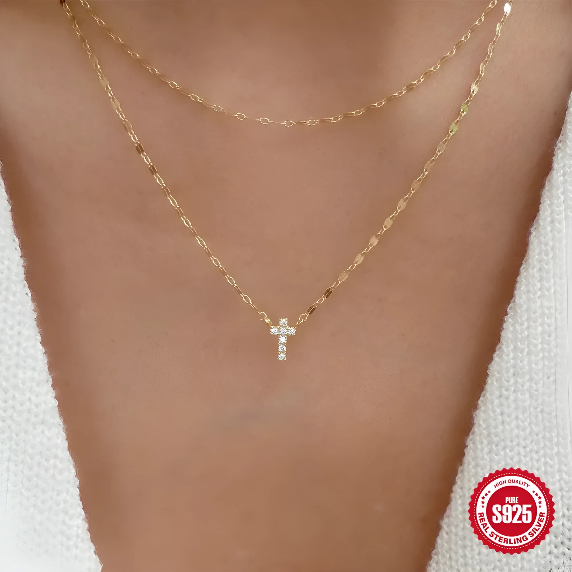 S925 sterling silver double layer twin diamond cross pendant on a clavicle chain, shown in gold and white gold finishes.