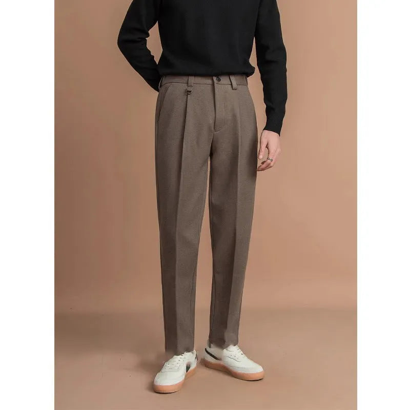 Men's straight-fit polyester trousers in dark grey, laid flat showing waistband and leg cut.