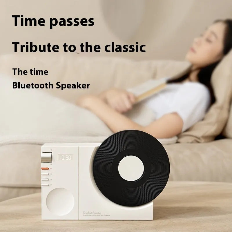 Mini Bluetooth speaker in obsidian black, ivory white, coral pink, and plum green colours