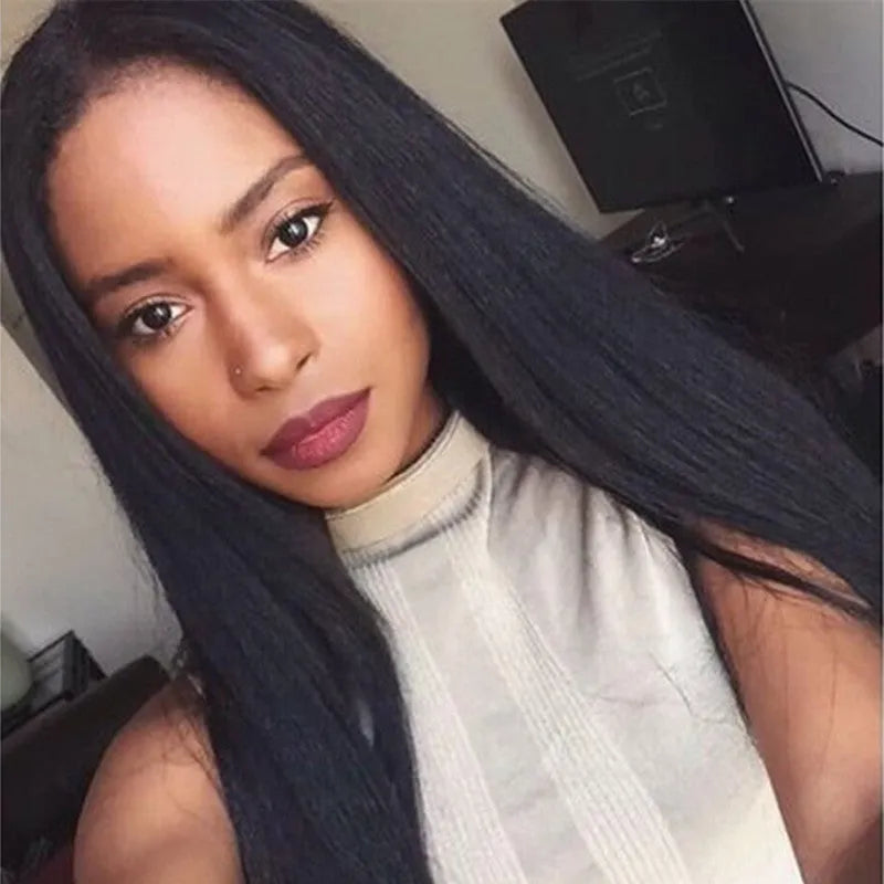 Long straight black synthetic wig with centre part and bangs on a mannequin head