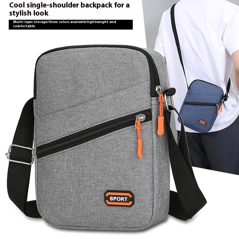 Ultra-light Oxford cloth crossbody commuter bag in black, navy blue, or silver grey with contrast colour detailing.
