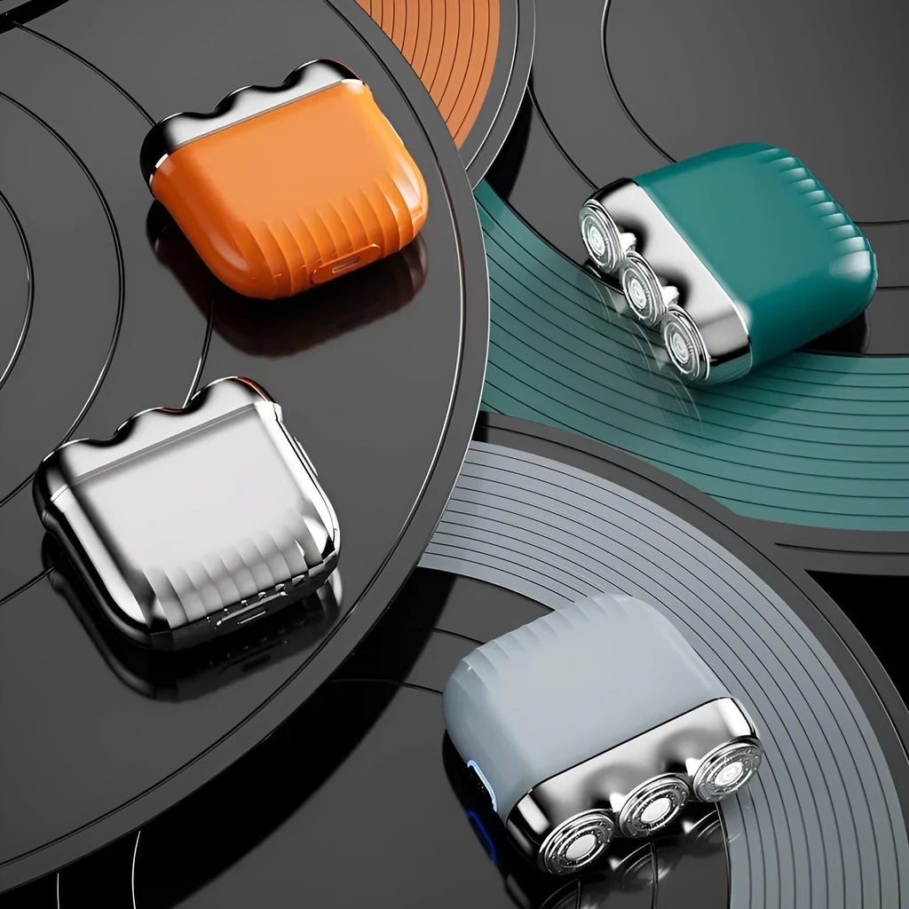 Three-head magnetic mini electric shaver in gun metal, orange, green, or blue colours with floating cutter design