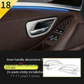 Set of four metallic silver trim strips for BMW 5 Series interior door handles.