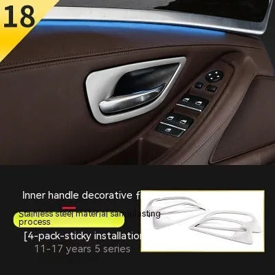 Set of four metallic silver trim strips for BMW 5 Series interior door handles.