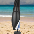 Black waterproof Oxford cloth banana-shaped cover for an offset patio umbrella.