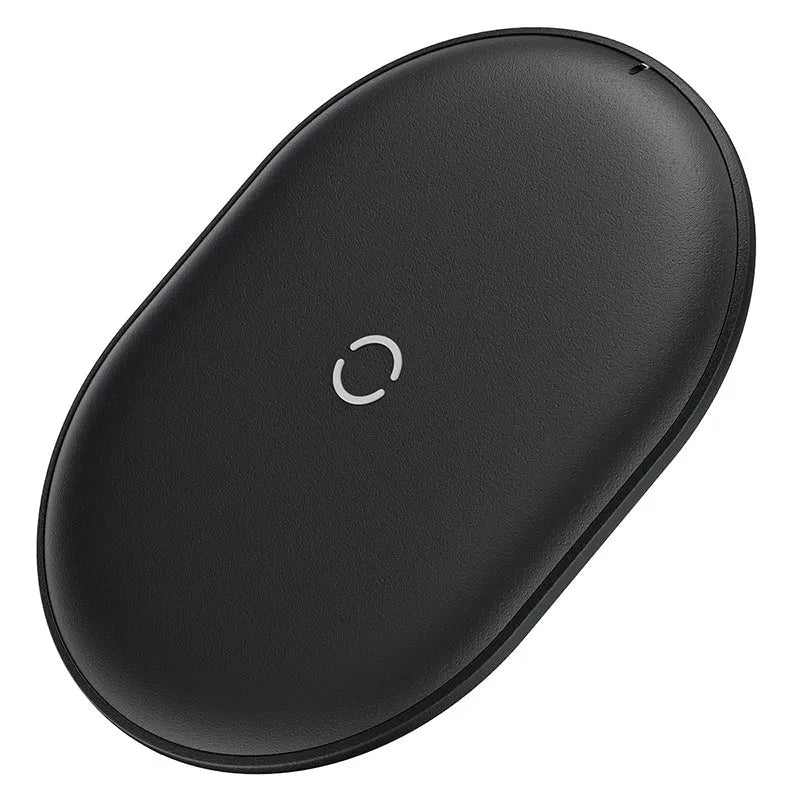 Baseus black wireless charging pad for mobile phones on a wooden surface