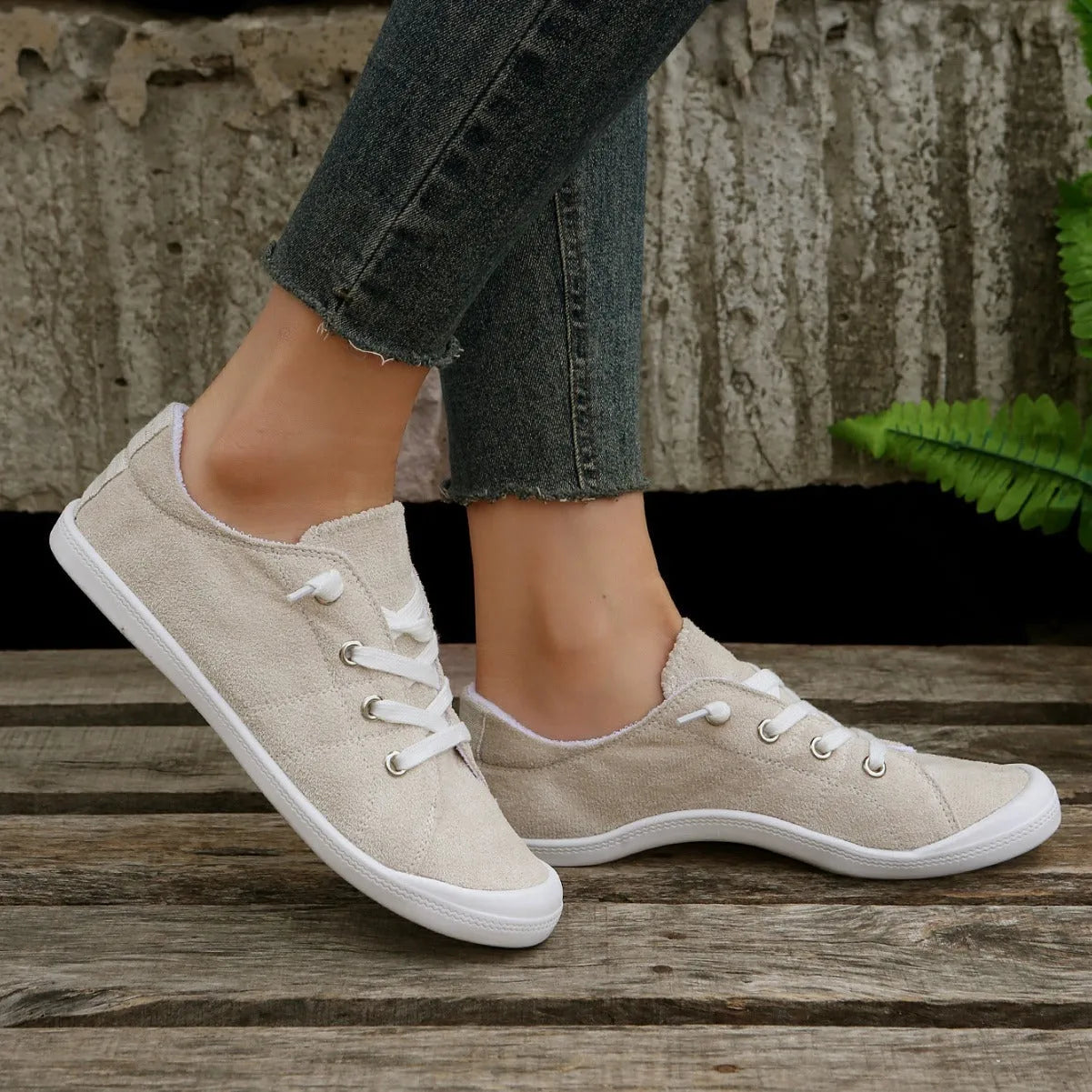 Women's creamy white low-top fabric casual sneaker on a wear-resistant rubber sole