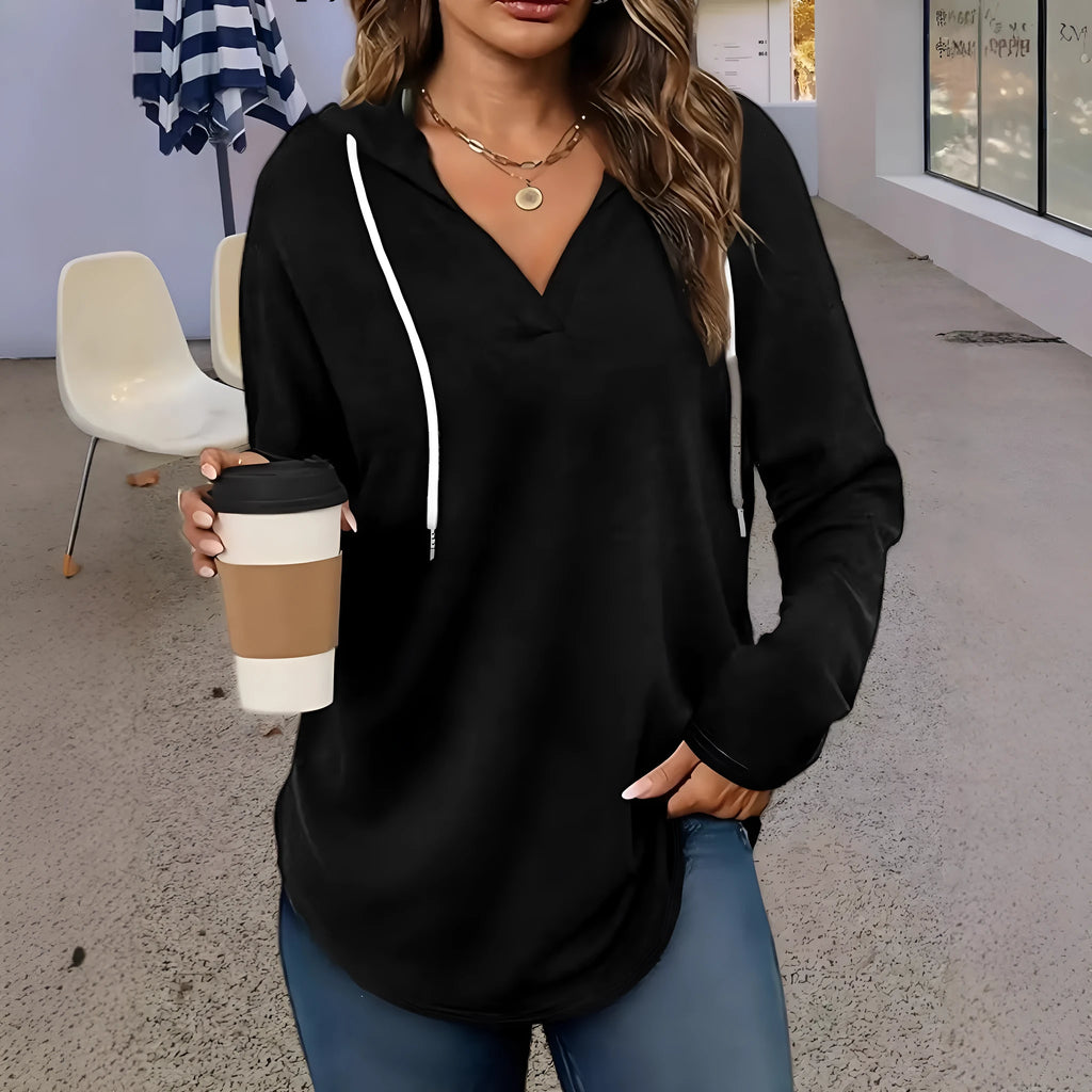 Red women's loose fit hooded V-neck sweatshirt on a hanger