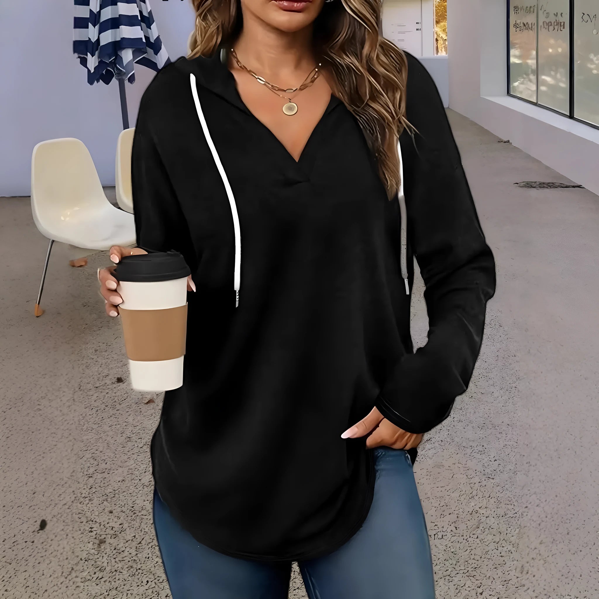 Red women's loose fit hooded V-neck sweatshirt on a hanger