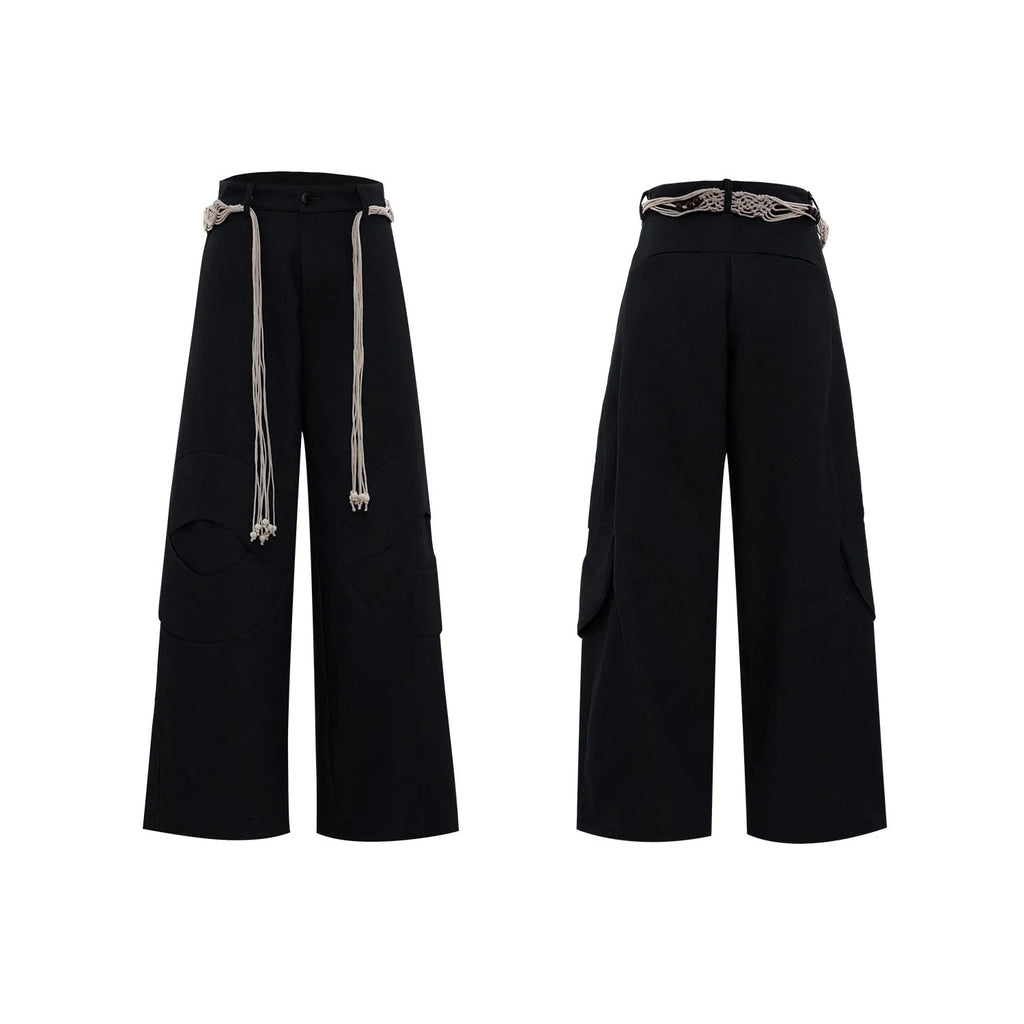 Men's dark blue straight-leg jeans showing heavy belt stitching, 3D cutting, zipper decoration, and a loose fit.