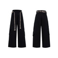 Men's dark blue straight-leg jeans showing heavy belt stitching, 3D cutting, zipper decoration, and a loose fit.