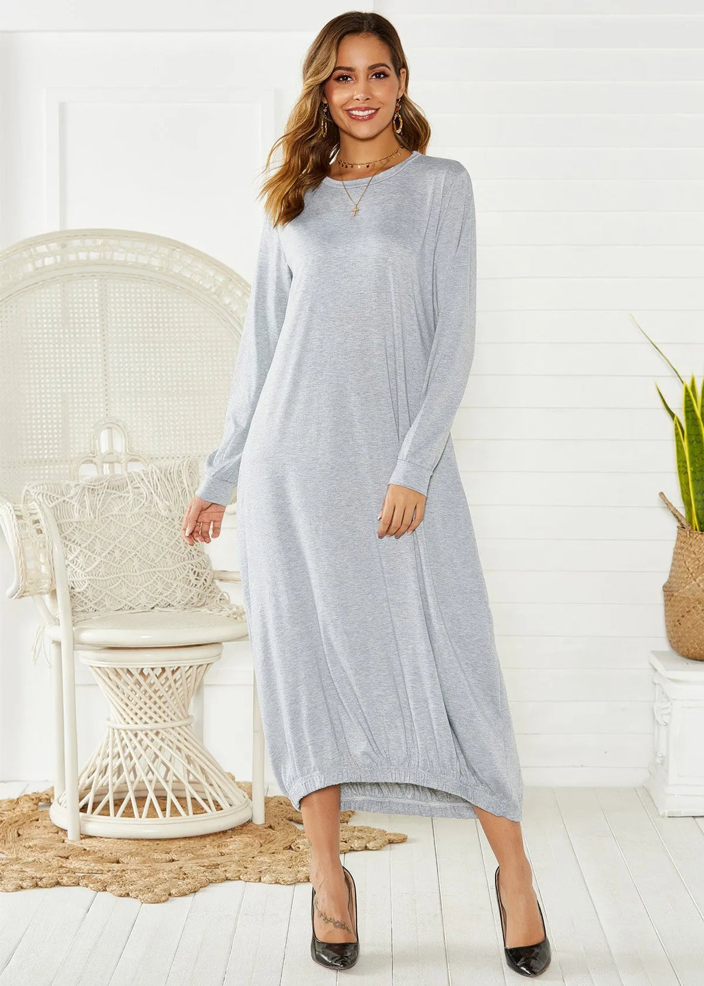 Women's black loose lantern dress with lace-up crew neck detail.