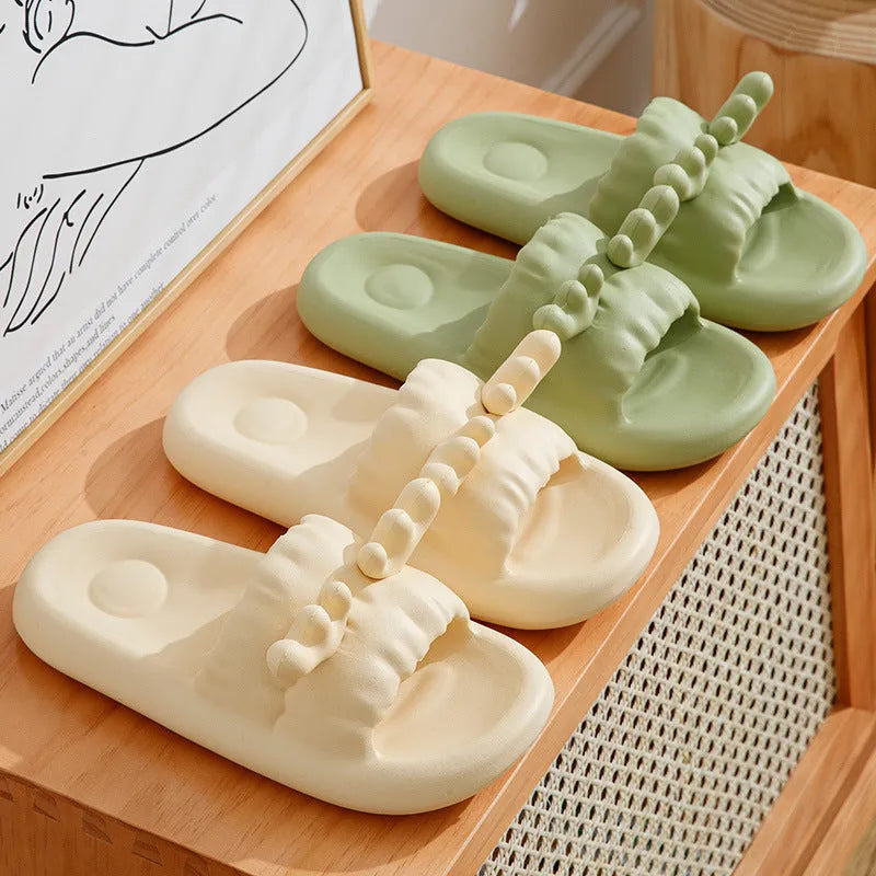 Deer horn design EVA flip flop slippers in light yellow, showing hollow out upper and textured sole.
