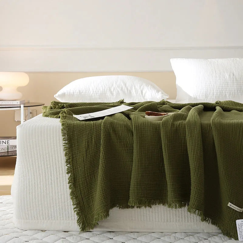 Four-layer gauze cotton blanket with tassel trim in avocado green colour