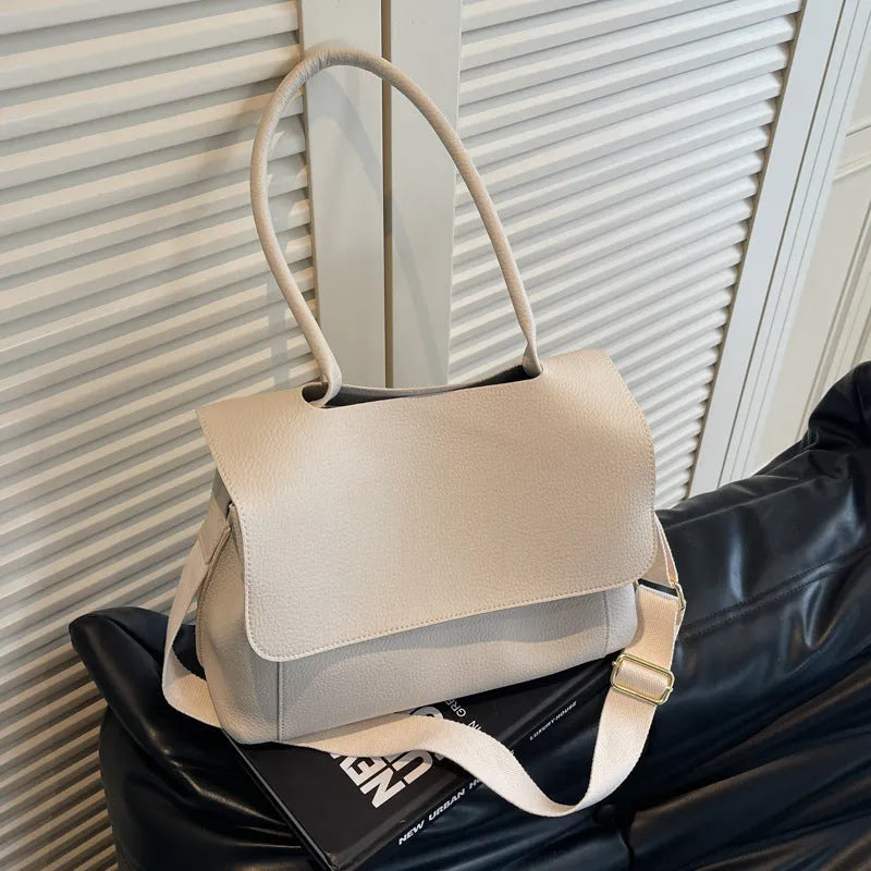 Vintage casual tote bag in horizontal square shape with double shoulder straps and visible sewing thread detailing