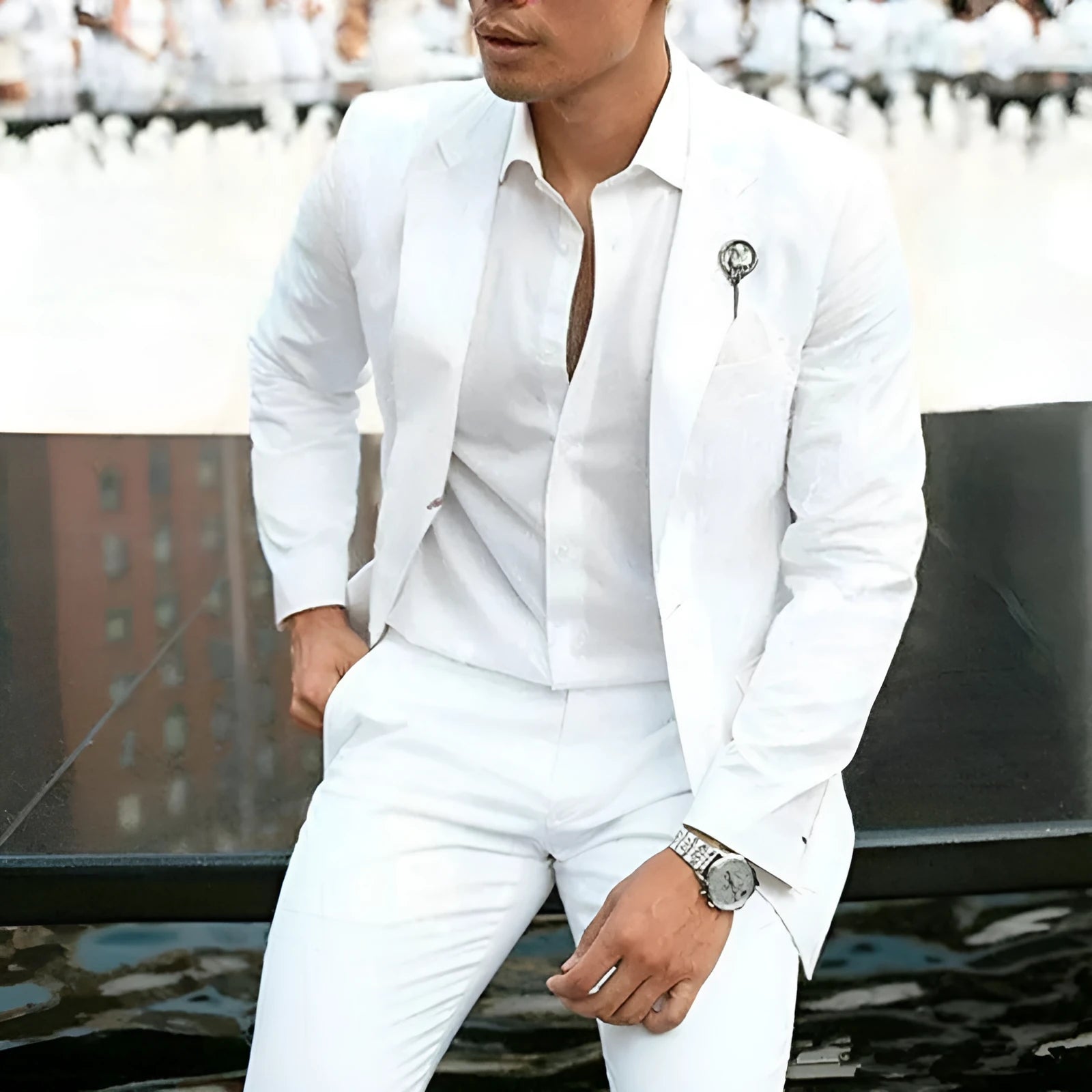 Men's white slim fit two-piece cotton suit on a hanger, showing jacket and trousers for formal events.