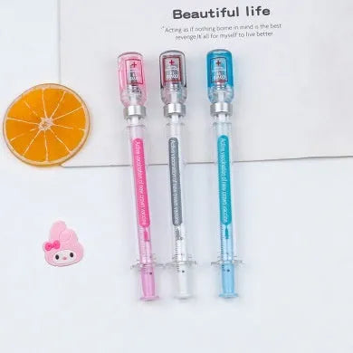 White and blue vaccine pen design gel pen with cap, shown next to a black full needle tube refill.