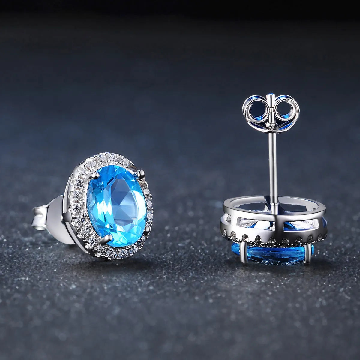 925 sterling silver blue topaz jewellery set with geometric design including earrings, ring, pendant and necklace