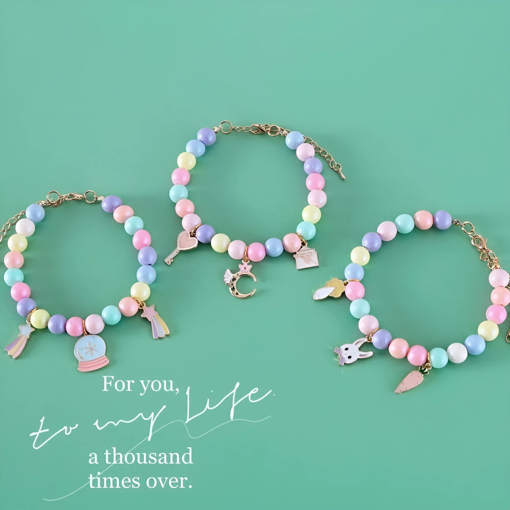 Pet wearing a resin headdress, collar, necklace, and bracelet set in a macaron colour with moon and star designs.