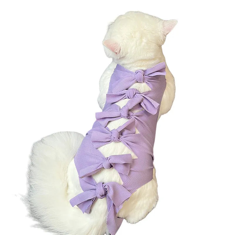 Lace-up polyester recovery clothing for cats after sterilisation, shown in multiple colours and sizes.