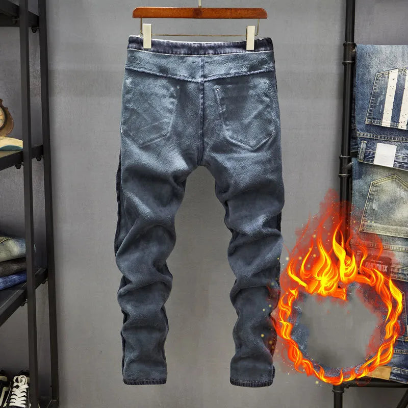 Men's dark blue skinny jeans with a slim fit and mid waist, laid flat.