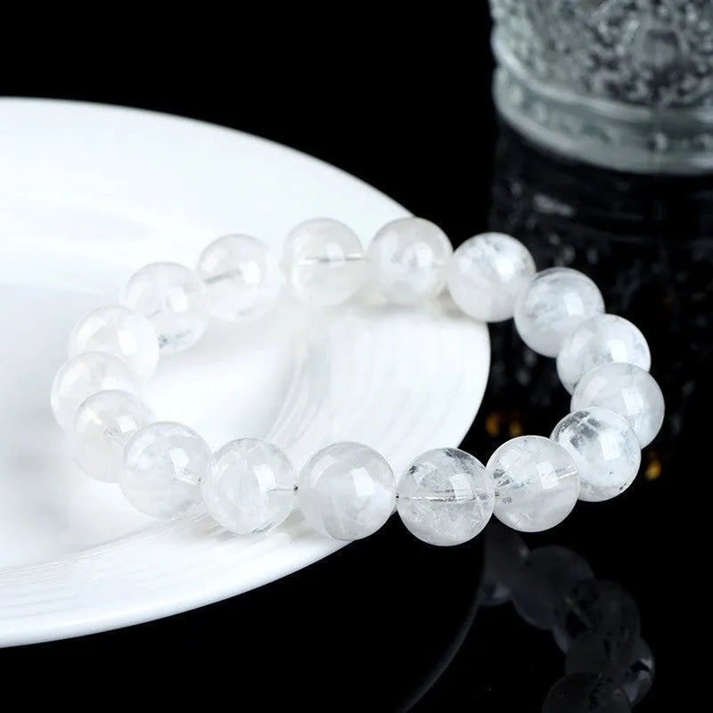 Women's bracelet with round blizzard snowflake crystal beads and traditional Ruyi Xiangyun decorative elements.