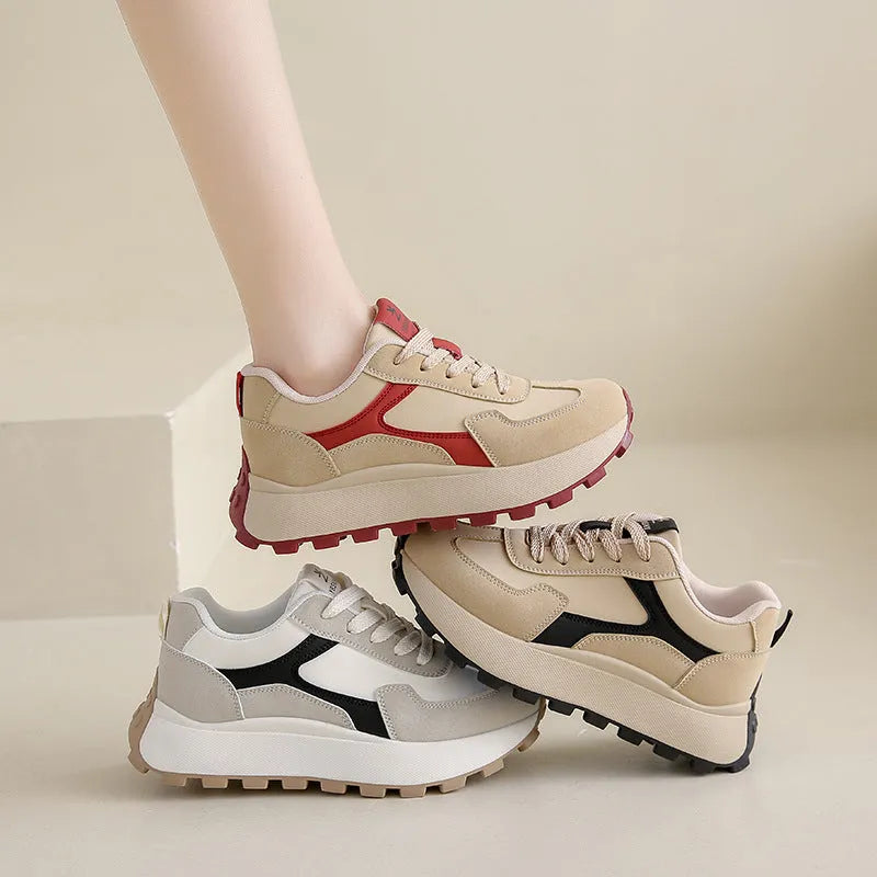 Women's low-top platform sports running shoes in solid colours with flat rubber sole and lace-up front.