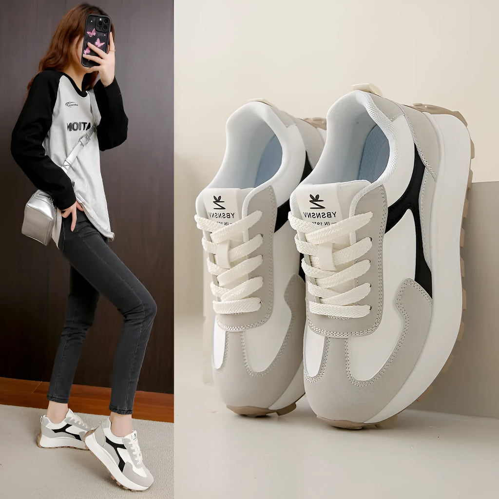 Women's low-top platform sports running shoes in solid colours with flat rubber sole and lace-up front.