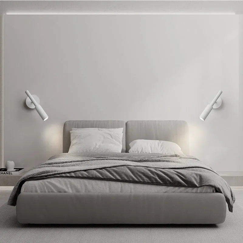 Modern wrought iron wall lamp in black with three colour light options for bedroom or living room