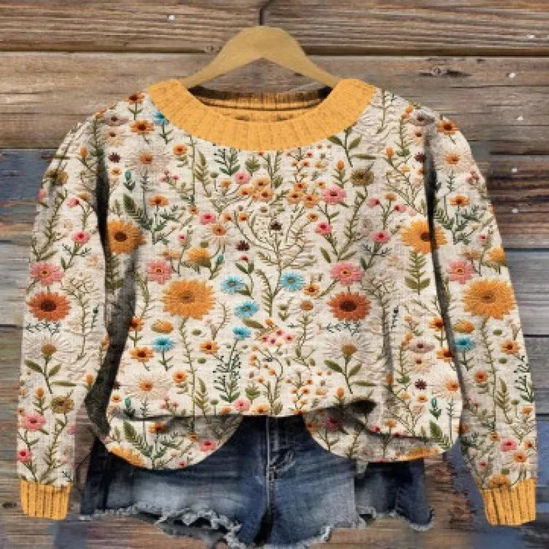 Women's round neck sweater with a digital floral print in a polyester fabric.